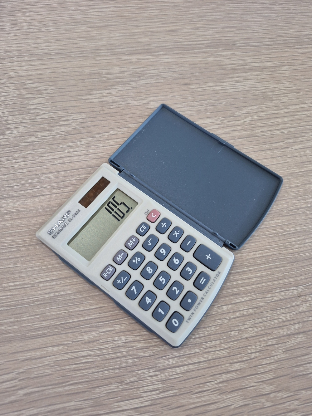 Sharp Solar-Powered Pocket Calculator in Beige and Dark Gray